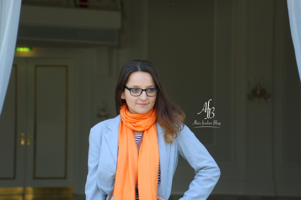 Casual grey meets orange scarf in Vienna